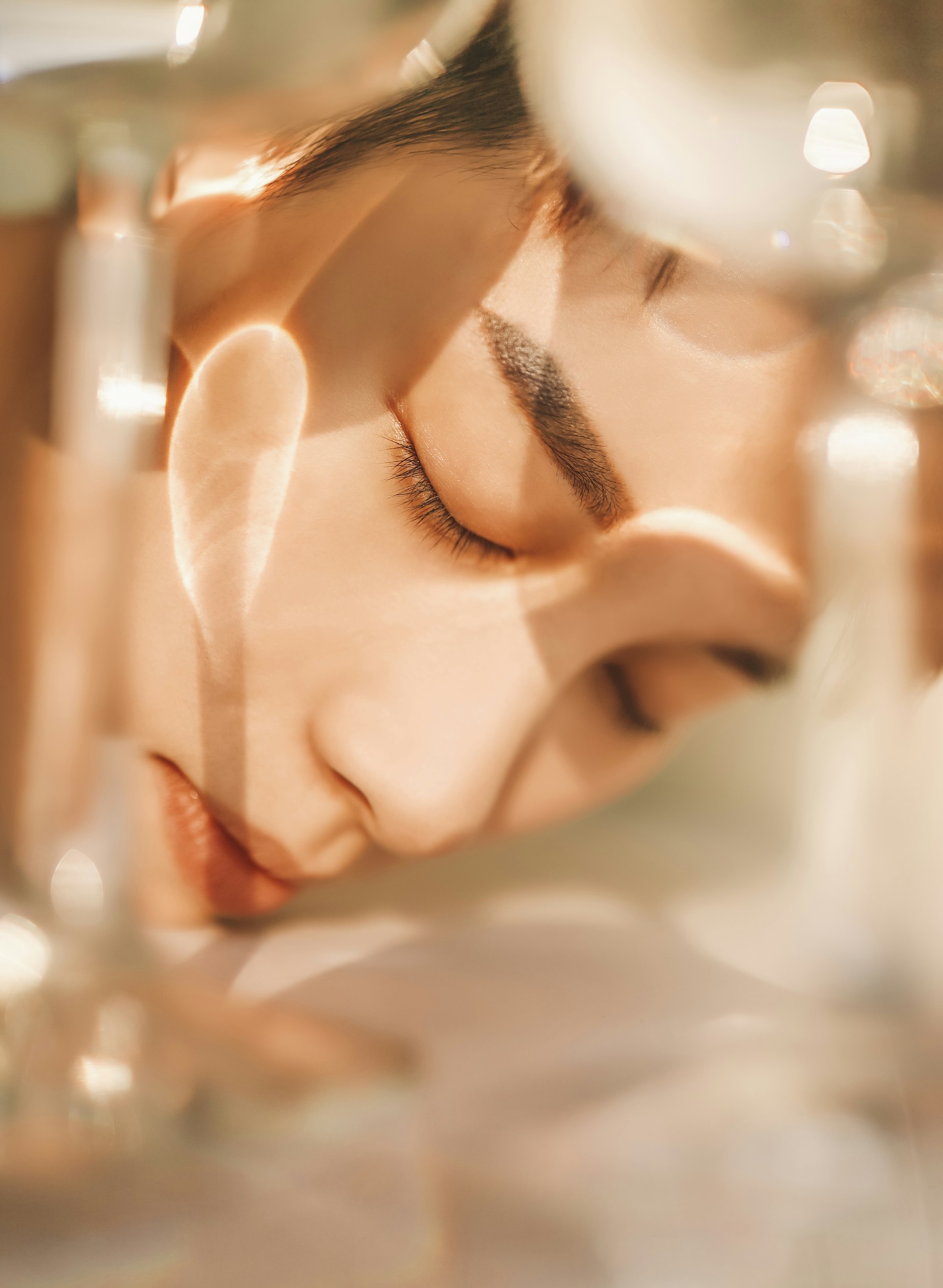 Woman with glowing, radiant skin in warm light